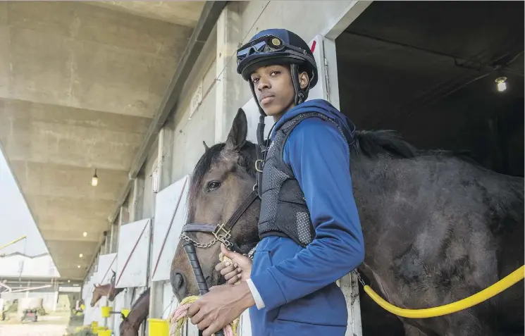  ?? SHAUGHN BUTTS ?? Nineteen-year-old jockey Rey Williams is turning heads at Northlands Park — and not just because he’s six feet tall. He’s building an impressive record of top-three finishes.