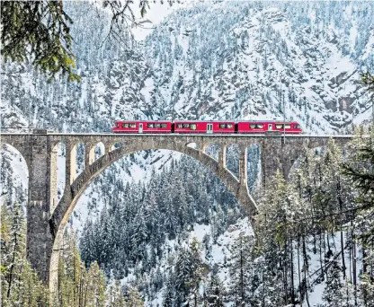  ?? ?? Bridge of sighs: the Bernina Express crosses the 180ftlong Wiesen Viaduct
The journey begins… Adrian sets off on his travels