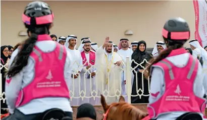  ?? Photos by M. Sajjad ?? PLENTY IS NOT ENOUGH: Sheikh Sultan greets riders at the inaugurati­on of the Pink Caravan Ride in Sharjah. —