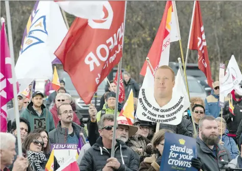  ?? TROY FLEECE ?? Hundreds of public sector workers and others demonstrat­e outside the legislatur­e on Wednesday against cuts to government spending they say will reduce services, roll back wages and eliminate jobs. “It’s really important for the people to show they...