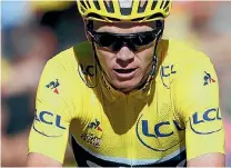  ?? CHRISTIAN HARTMANN/REUTERS ?? Chris Froome remains in the yellow jersey after a treacherou­s 15th stage of the Tour de France.