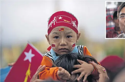  ??  ?? A child wearing a National League for Democracy headband attends a voter education rally featuring NLD leader Aung San Suu Kyi in Ho Pone township in Shan State.