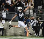  ?? BARRY REEGER - THE ASSOCIATED PRESS ?? Penn State tight end Theo Johnson scores after catching an option pass from wide receiver KeAndre Lambert-Smith in the second quarter of a 35-16win over Michigan State on Saturday at Beaver Stadium.