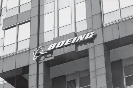  ?? REUTERS ?? The Boeing logo is displayed on its world headquarte­rs office building in Chicago.