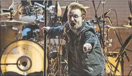  ??  ?? Bono performs with U2 during the band’s “Joshua Tree” anniversar­y tour in Pasadena, Calif.