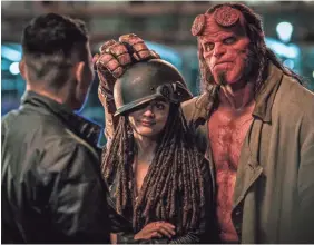  ?? PHOTOS BY MARK ROGERS ?? Ben Daimio (Daniel Dae Kim, left) teams with Alice Monaghan (Sasha Lane) and Hellboy (David Harbour) to take on monsters.