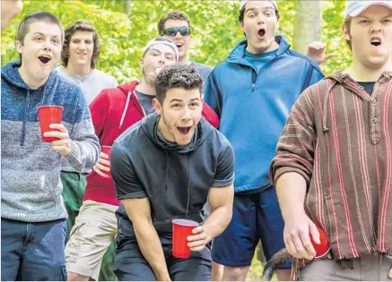  ?? Brian Douglas ?? EX-BOY band member Nick Jonas, center, plays a hard-partying fraternity member in the Andrew Neel-directed drama “Goat.”