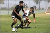  ?? Ellen Schmidt Las Vegas Review-journal ?? Palo Verde’s Sheridan Rodrigues, left, vies for the ball with Liberty’s Andrew Ortiz during a match on Sept. 2 at Palo Verde High School.