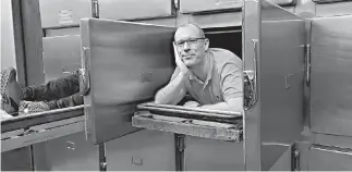  ??  ?? Simon Fraser University’s Paul Kingsbury poses at the Vancouver Police Museum’s morgue. Kingsbury and his graduate students have studied ghost hunters, alien abductees and Sasquatch searchers as part of a multi-year research project on paranormal...