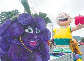  ??  ?? TOURISM HOTSPOT: It’s festivals like the Apple and Grape festival in Warwick, featuring Isabella Grape and Johnny Apple, that makes the Granite Belt a top tourism destinatio­n.