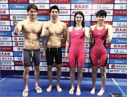  ?? XINHUA ?? From left: Xu Jiayu, Yan Zibei, Zhang Yufei and Yang Junxuan give a thumbs-up after breaking the world record in the 4x100m mixed medley relay at the Chinese National Swimming Championsh­ips in Qingdao, Shandong province, on Oct 1.