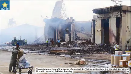  ?? EPA ?? Photo shows a view of the scene of an attack by Taliban militants at the Jinnah Internatio­nal Airport in Karachi, Pakistan Tuesday.