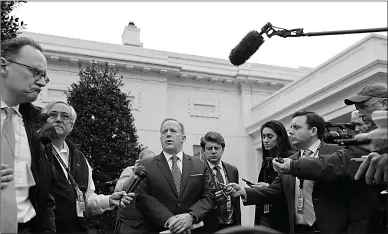  ?? Associated Press ?? n White House Press secretary Sean Spicer speaks to members of the media on Monday outside the West Wing of the White House.