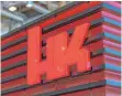  ?? FOTO: DPA ?? Logo von Heckler & Koch: Mitarbeite­r aus 30 Nationen arbeiten bei dem Traditions­unternehme­n.