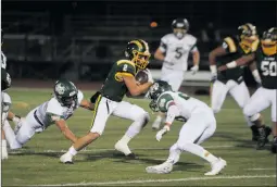  ?? Christian Monterrosa/ The Signal ?? Carson Strickland breaks several tackles after a short pass against Mira Costa in a playoff game on Saturday in Canyon Country. Canyon lost the game, 4 5-28, to end the season 6- 6 overall.