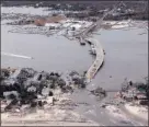  ?? DOUG MILLS/ASSOCIATED PRESS ARCHIVES ?? Rising sea level: Superstorm Sandy’s tidal surge damaged a long stretch of the Atlantic coast in October 2012.