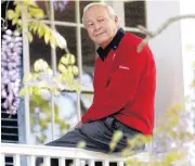  ??  ?? This 2004 file photo shows former Masters champion Arnold Palmer as he sits on clubhouse railing at the Augusta National Golf Club in Augusta, Ga.