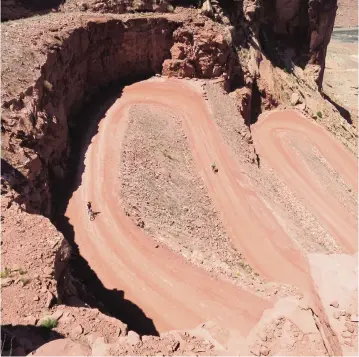  ?? MARK SEVENOFF ?? E-bike riders climb switchback­s on White Rim Road in Utah. Riders without bike-handling experience might run into trouble in bad or wet trail conditions.