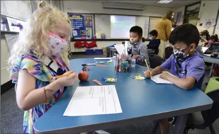  ?? Cliff Grassmick / Staff Photograph­er ?? A Tuesday endorsemen­t of vaccinatin­g 5- to 11-year-olds against COVID-19 means millions more kids, like these St. Vrain Valley first-graders, are a step closer to being eligible for inoculatio­n with Pfizer’s shots.