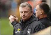  ?? MIKE EGERTON — PA ?? Coventry City manager Mark Robins looks on before an English FA Cup quarterfin­al against Wolverhamp­ton in Wolverhamp­ton, England, on Saturday.