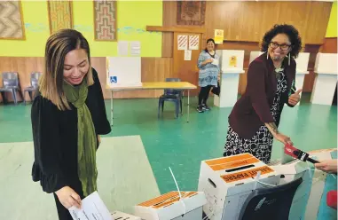  ?? . RICKY WILSON/STUFF ?? Green Party co-leader Marama Davidson votes alongside Darleen Tana at last year’s election