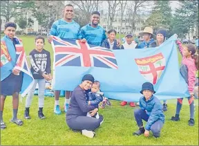  ?? Picture: RAVULOLO TAGIVETAUA/HAMILTON, NZ ?? Go Fiji, go ... Flying Fijians fans with their stars during the team’s training run at Hamilton, NZ yesterday.