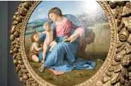  ??  ?? Raphael’s “Alba Madonna” is back in Italy for the first time since the 17th century. The painting is seen Monday at the Scuderie del Quirinale in Rome. Photo for The Washington Post by Ginevra Sammartino