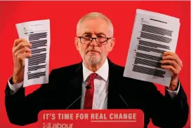  ??  ?? Dupe: Mr Corbyn holds up copies of the leaked trade papers