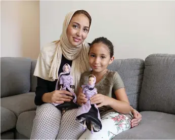  ?? Photos by Pawan Singh / The National ?? Samira Amarir and daughter Jennah with her namesake Quran doll