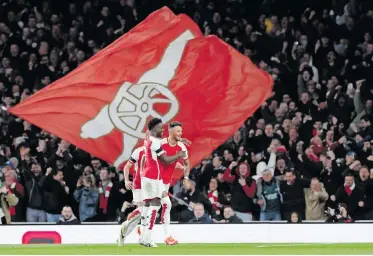  ?? | EPA ?? BEN White (right) celebrates after scoring Arsenal’s second goal against Chelsea on Tuesday.