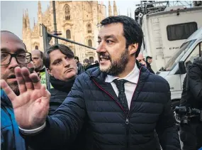  ?? BLOOMBERG FILES ?? Matteo Salvini, leader of the anti-immigrant League party, centre, speaks with attendees after an election campaign rally in Milan on Saturday.