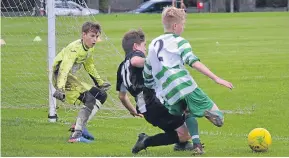  ??  ?? Celtic U/15s (green and white) beat Jeanfield Swifts 3-2 after extra time in the Scottish Cup first-round last weekend.