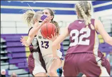  ?? Brad Cochi / Bocopreps.com ?? Holy Family's Alyssa Wells, center, drives to the basket against Windsor on Friday.