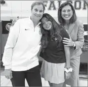  ?? ALICIA DELGALLO/PRO SOCCER USA ?? United States women's national team coach Jill Ellis, left, with her daughter, Lily, and wife, Betsy, following a Q&A session at Lily's school in Palmetto Bay, Florida.