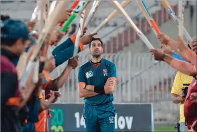  ?? (AFP) ?? Teammates and opponents give a guard of honour to Pakistani cricketer Umar Gul during the National T20 Cup in Rawalpindi on Friday.