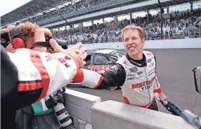  ??  ?? Brad Keselowski celebrates Monday after winning the Brickyard 400 at Indianapol­is Motor Speedway. AJ MAST/AP