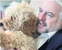  ??  ?? Carwyn with Ted - the family’s cockapoo