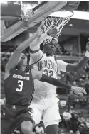  ?? PAUL VERNON/AP ?? Ohio State’s E.J. Liddell, who had a career-high 34 points, blocks a shot by Northweste­rn’s Ty Berry.