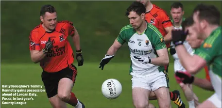  ?? Ballydonog­hue’s Tommy Kennelly gains possession ahead of Lorcan Daly, Fossa, in last year’s County League ??