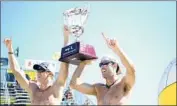  ?? Christina House For The Times ?? TRI BOURNE, left, and then-partner John Hyden celebrate a 2015 victory in Huntington Beach.