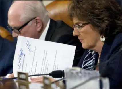  ?? JOSE LUIS MAGANA — THE ASSOCIATED PRESS ?? Rep. Jackie Walorski, R-Ind., read her notes during a House Ways and Means Committee Oversight Subcommitt­ee hearing on on proposals to compel presidents and presidenti­al candidates to make public years of their tax returns on Capitol Hill, Thursday in Washington. But the burning question is what Democrats might do more immediatel­y to get such files from President Donald Trump.