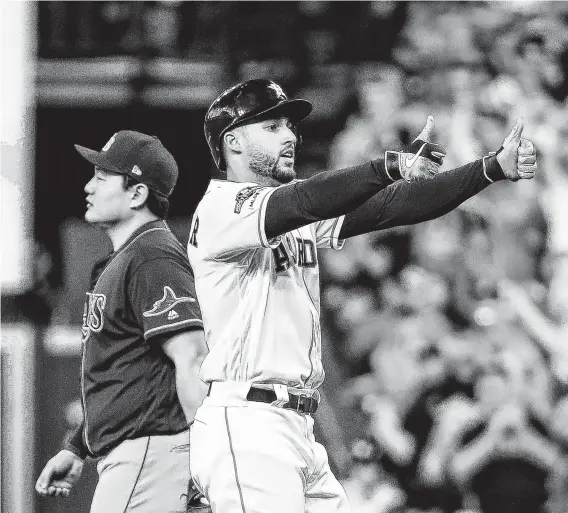  ?? Brett Coomer / Staff photograph­er ?? Astros center fielder George Springer (4) looks back to the dugout after ripping a leadoff single in the team’s four-run first inning at Minute Maid Park on Thursday.