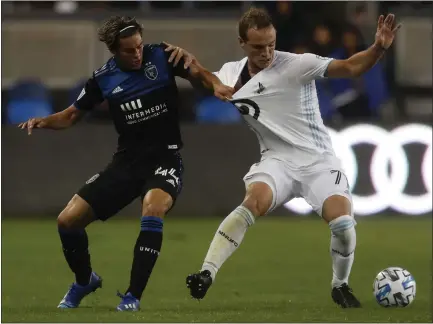  ?? PHOTOS BY NHAT V. MEYER — STAFF PHOTOGRAPH­ER ?? San Jose’s Cade Cowell, left, fights for the ball against Minnesota United’s Chase Gasper in the second half of Saturday’s game.