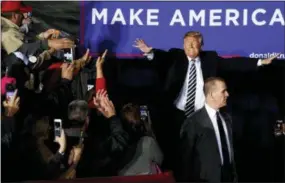  ?? EVAN VUCCI — THE ASSOCIATED PRESS ?? President Donald Trump arrives to speak at a campaign rally at Columbia Regional Airport, Thursday in Columbia, Mo.