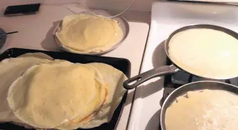  ?? ?? Crepes cook on the stovetop in the kitchen of columnist Jerry Davich. Watch a video how he makes them on his Facebook page.