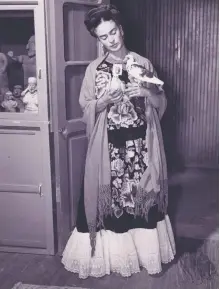  ??  ?? Nickolas Muray: Frida With Diego and Gas Mask, 1938; Juan Guzmán: Frida Alone With Two Doves, 1946