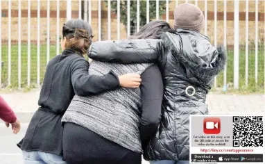  ?? PICTURE: JACK LESTRADE ?? IN PAIN: Relatives of the victim outside the Mitchells Plain Magistrate’s Court yesterday.