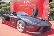  ?? PAWAT LAOPAISARN­TAKSIN ?? Mr Voravud stands next to a La Ferrari Aperta. Cavallino Motors plans to invest 10 million baht this year upgrading its showroom and service centre.