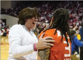  ?? DARRON CUMMINGS — THE ASSOCIATED PRESS ?? Miami head coach Katie Meier celebrates with Destiny Harden after Miami defeating Indiana in a second-round game in the NCAA Tournament on Monday, in Bloomingto­n, Ind.