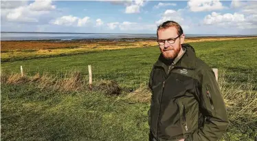  ?? Martin Selsoe Sorensen / New York Times ?? Bent Rasmussen is in charge of a fence that Denmark intends to build along its border with Germany to keep out sick wild pigs. But some political foes fear such a structure could be used to block refugees.